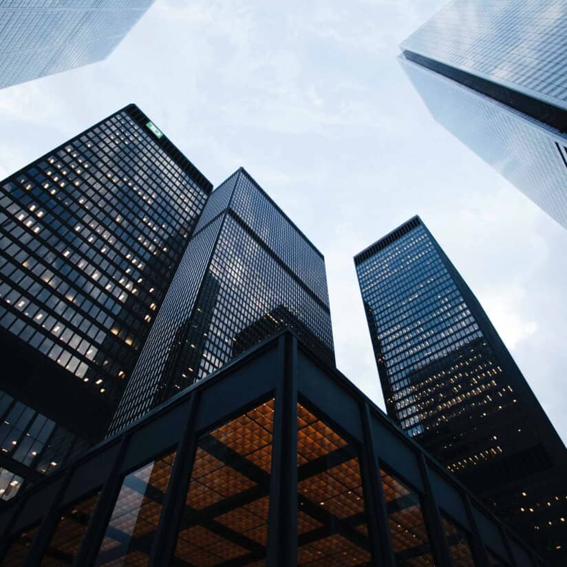 low angle view of city high rise buildings during daytime.