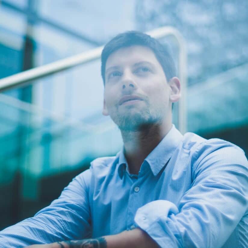 A person looking out a window.